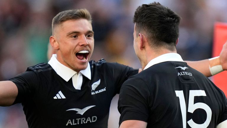 New Zealand's Will Jordan, right, is congratulated by teammate Cortez Ratima after scoring a try against Australia during their rugby union test match in Sydney, Saturday, Sept. 21, 2024. (AP Photo/Rick Rycroft)