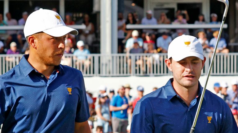 CHARLOTTE, NC - SEPTEMBER 24: From left to right USA Presidents Cup golfers Xander Schauffele and Patrick Cantlay walk to the 16th tee during the 2022 Presidents Cup four-ball on September 24, 2022 at Quail Hollow Club in Charlotte, North Carolina. (Photo by Brian Spurlock/Icon Sportswire) (Icon Sportswire via AP Images)