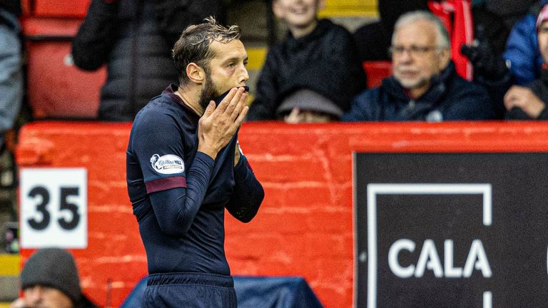 AHearts' Jorge Grant looks dejected after being sent off for a second yellow offence