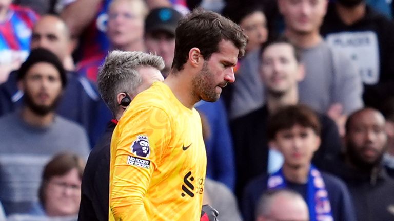 Liverpool goalkeeper Alisson Becker leaves the pitch with an injury at Crystal Palace