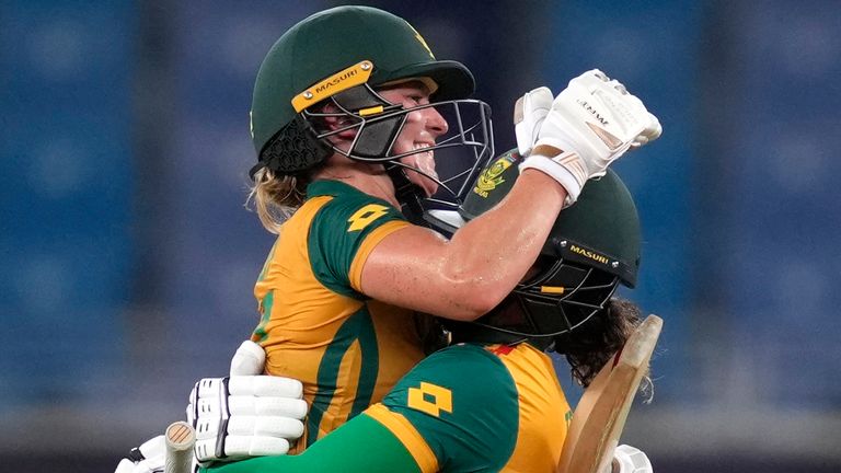 South Africa's Anneke Bosch and Chloe Tryon celebrate the Women's T20 World Cup semi-final win over Australia in Dubai (Associated Press)