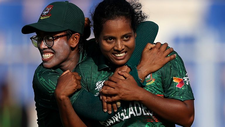 Bangadesh's Ritu Moni celebrates with team-mate Fahima Khatun after taking the wicket of Scotland's Ailsa Lister