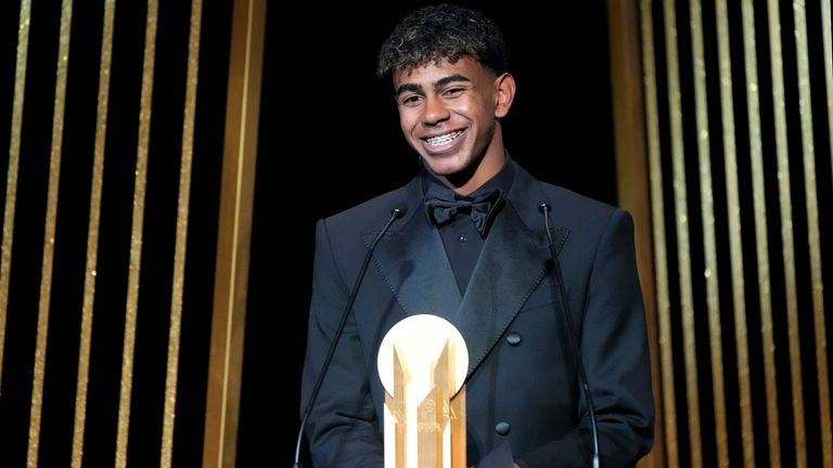 Barcelona's Spanish player Lamine Yamal receives the Kopa Trophy during the 68th Ballon d'Or (Golden Ball) award ceremony at Theatre du Chatelet in Paris, Monday, Oct. 28, 2024. (AP Photo/Michel Euler)