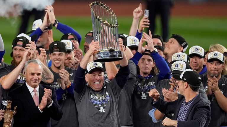 President and CEO of the Los Angeles Dodgers, Stan Kasten, holds up the trophy after the Dodgers beat the New York Yankees in Game 5 to win the baseball World Series, Thursday, Oct. 31, 2024, in New York. (AP Photo/Seth Wenig)