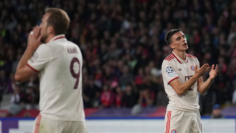 Bayern's Harry Kane, left, and Joao Palhinha react after missing a chance during the Champions League opening phase soccer match between Barcelona and Bayern Munich at the Lluis Companys Olympic Stadium in Barcelona, Spain, Wednesday, Oct. 23, 2024. (AP Photo/Emilio Morenatti)