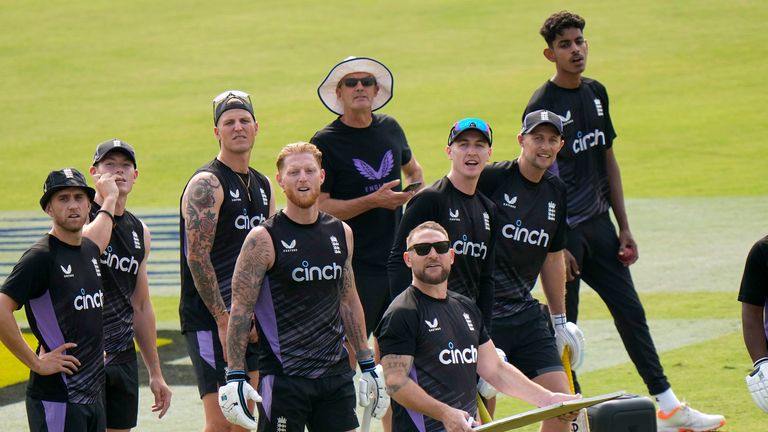 England's coach Brendon McCullum, center in glasses, skipper Ben Stokes, fourth left, and teammates attend a practice session, in Rawalpindi, Pakistan, Wednesday, Oct. 23, 2024. (AP Photo/Anjum Naveed) 