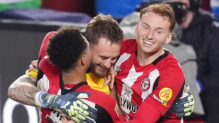 Brentford goalkeeper Mark Flekken (centre) celebrates with team-mates after saving a penalty in the shoot-out from Sheffield Wednesday's Liam Palmer to win the game during the Carabao Cup fourth round match at the Gtech Community Stadium, London. Picture date: Tuesday October 29, 2024.