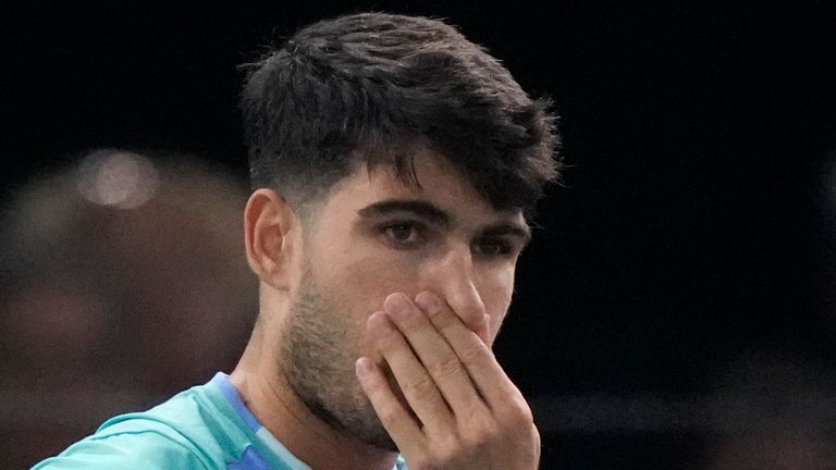 Spain's Carlos Alcaraz reacts as he plays France's Ugo Humbert during their third round match of the Paris Masters tennis tournament at the Accor Arena, Thursday, Oct. 31, 2024 in Paris. (AP Photo/Michel Euler)