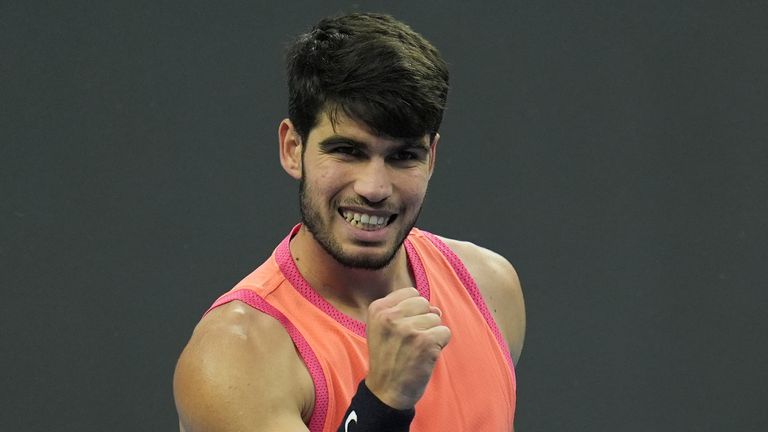 Carlos Alcaraz of Spain celebrates after defeating Karen Khachanov of Russia ,during the China Open tennis tournament held at the National Tennis Center in Beijing, Monday, Sept. 30, 2024. (AP Photo/Ng Han Guan)