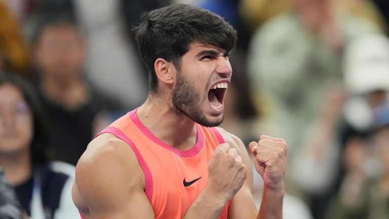 Carlos Alcaraz reacts after clinching victory over Jannik Sinner in the China Open final