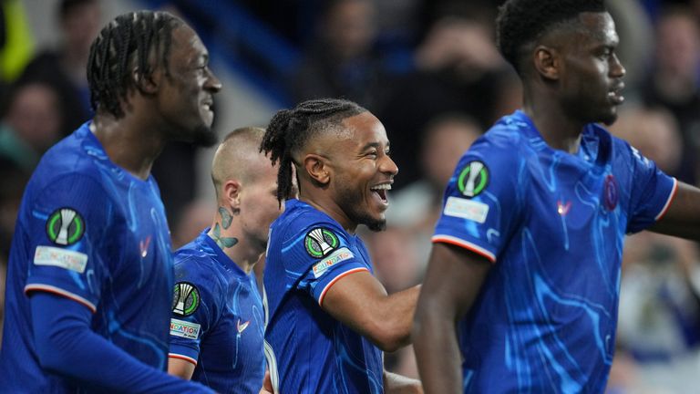 Chelsea's Christopher Nkunku, center, celebrates with teammates after scoring his side's third goal during the Europa Conference League opening phase soccer match between Chelsea and Gent at Stamford Bridge in London, Thursday, Oct. 3, 2024. (AP Photo/Kin Cheung)