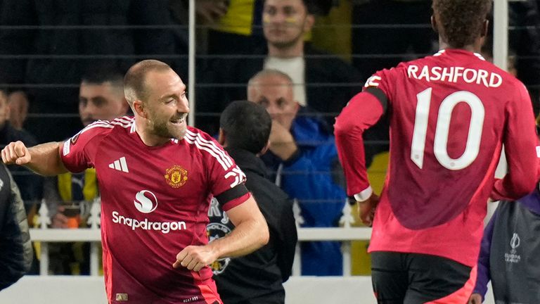 Manchester United's Christian Eriksen (left) celebrates after scoring the opening goal in the opening Europa League match between Fenerbahce and Manchester United at Sükrü Saracoglu Stadium in Istanbul, Turkey, on Thursday, October 24, 2024. (AP Photo/Francisco Seco)