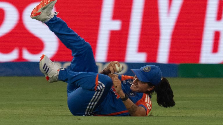 India's Renuka Thakur dives to take a catch to dismiss Sri Lanka's Kavisha Dilhari during the ICC Women's T20 World Cup 2024 match between India and Sri Lanka at Dubai International Stadium, United Arab Emirates, Wednesday, Oct. 9, 2024. (AP Photo/Altaf Qadri)