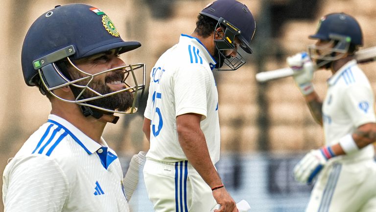 India's Virat Kohli reacts as he walks off the field after losing his wicket against New Zealand