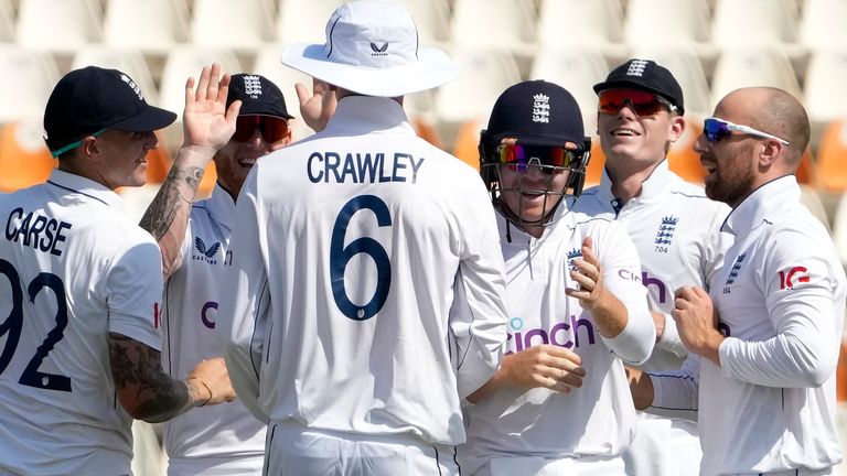 England's Jack Leach, right, celebrates with team-mates after taking the wicket of Pakistan's Shan Masood during the first day of the second Test