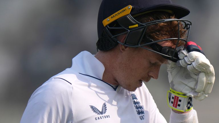 England's Ollie Pope reacts as he walks off the field after his dismissal during the first day of the second test cricket match between Pakistan and England, in Multan, Pakistan, Friday, Dec. 9, 2022. (AP Photo/Anjum Naveed)