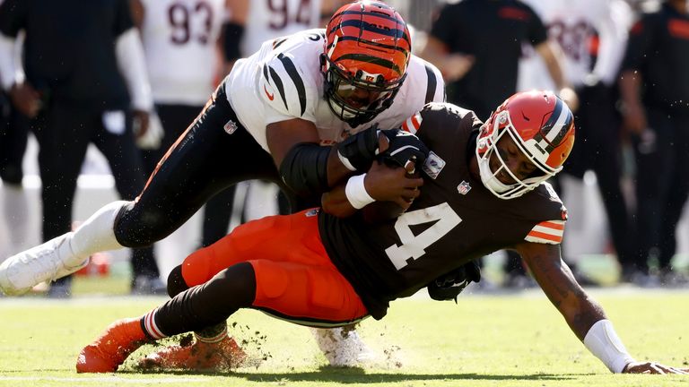 Cincinnati Bengals defensive tackle Sheldon Rankins (98) sacks Cleveland Browns quarterback Deshaun Watson (4) during an NFL football game, Sunday, Oct. 20, 2024, in Cleveland. (AP Photo/Kirk Irwin)