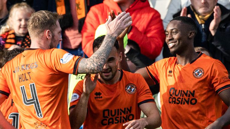 PAISLEY, SCOTLAND - OCTOBER 05: Dundee United's Emmanuel Adegboyega celebrates as he scores to make it 1-0 as the fans run onto the pitch during a William Hill Championship match between St Mirren and Dundee United at the SMiSA Stadium, on October 05, 2024, in Paisley, Scotland. (Photo by Craig Williamson / SNS Group)