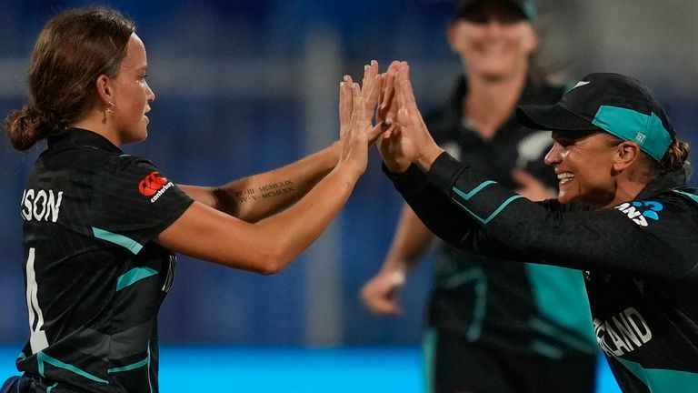 New Zealand's Eden Carson, left, celebrates with teammates after the dismissal of West Indies' Qiana Joseph during the ICC Women's T20 World Cup 2024 semi-final match between New Zealand and West Indies at Sharjah Stadium, United Arab Emirates, Friday, Oct. 18, 2024. (AP Photo/Altaf Qadri)