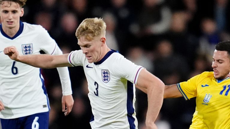 England's Lewis Hall (centre) and Ukraine's Nazar Voloshin (right) compete for the ball during their UEFA U21 European Championship Group F match at Vitality Stadium in Bournemouth. Image date: Friday, October 11, 2024.