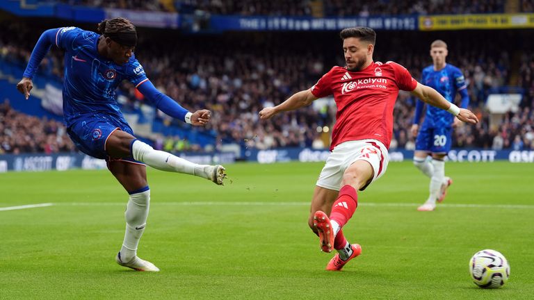 Chelsea's Noni Madueke crosses the ball under pressure from Nottingham Forest's Alex Moreno