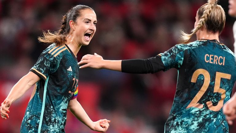 Sara Dabritz (left) celebrates scoring Germany's fourth from the penalty spot.