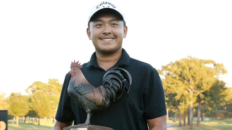 Kevin Yu, of Taiwan, holds the Sanderson Farms Championship trophy following his win of the 2024 tournament hosted at the Country Club of Jackson on Sunday, Oct. 06, 2024, in Jackson, Miss. (AP Photo/Sarah Warnock)