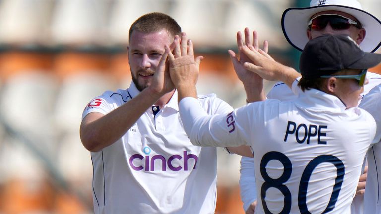 England's Gus Atkinson, center, celebrates with teammates after taking the wicket of Pakistan's Saim Ayub during the first day of the first test cricket match between Pakistan and England, in Multan, Pakistan, Monday, Oct. 7, 2024. (AP Photo/Anjum Naveed)