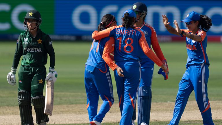 Indian players celebrate the wicket of Pakistan's Aliya Riaz, left, during the ICC Women's T20 World Cup 2024 match between Pakistan and India at Dubai International Stadium, United Arab Emirates, Sunday, Oct. 6, 2024. (AP Photo/Altaf Qadri)