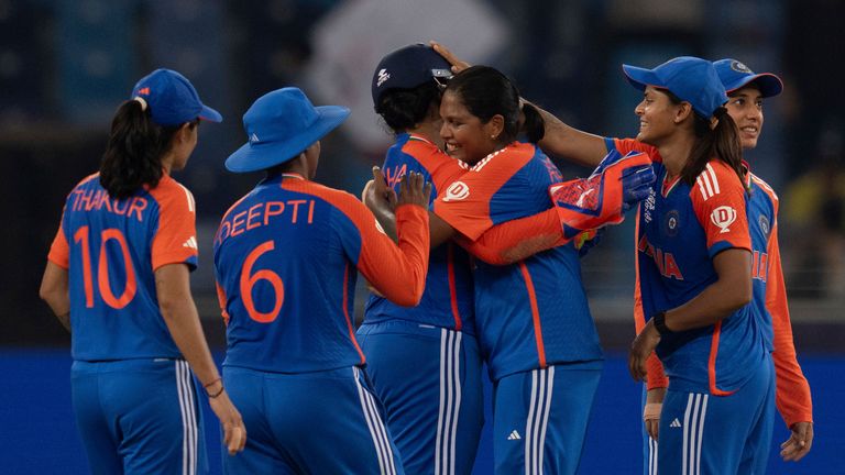 Teammates congratulate India's wicketkeeper Richa Ghosh centre, after she took a catch to dismiss Sri Lanka's Sugandika Kumari during the ICC Women's T20 World Cup 2024 match between India and Sri Lanka at Dubai International Stadium, United Arab Emirates, Wednesday, Oct. 9, 2024. (AP Photo/Altaf Qadri)