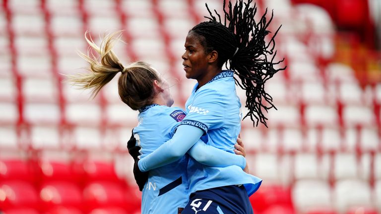 Khadija Shaw celebrates her second goal with Lauren Hemp