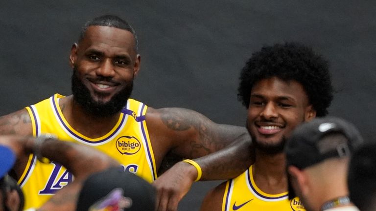 Los Angeles Lakers' LeBron James, left, and his son, Bronny James, pose for photos during the NBA basketball team's media day in El Segundo, Calif., Monday, Sept. 30, 2024. (AP Photo/Jae C. Hong)