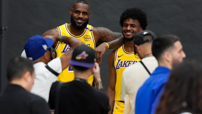 Los Angeles Lakers' LeBron James, left, and his son, Bronny James, pose for photos during the NBA basketball team's media day in El Segundo, Calif., Monday, Sept. 30, 2024. (AP Photo/Jae C. Hong)