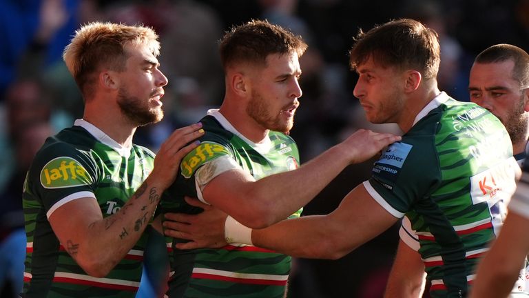 Leicester Tigers' Josh Bassett (right) celebrates with teammates after scoring their second try of the game during the Gallagher Premiership match at Mattioli Woods Welford Road Stadium, Leicester. Picture date: Sunday October 20, 2024.   