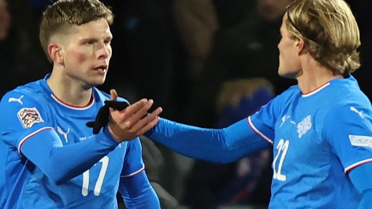 Iceland's Logi Tomasson, left, celebrates after scoring his side's first goal during the UEFA Nations League group 4 soccer match between Iceland and Wales in Reykjavik, Iceland, Friday, Oct. 11, 2024. (AP Photo/Arni Torfason)