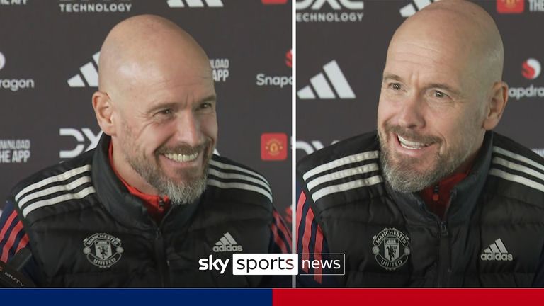 Erik Ten Hag jokes with the journalists waiting to question him after the return of the International break as he enters the room to begin his press conference