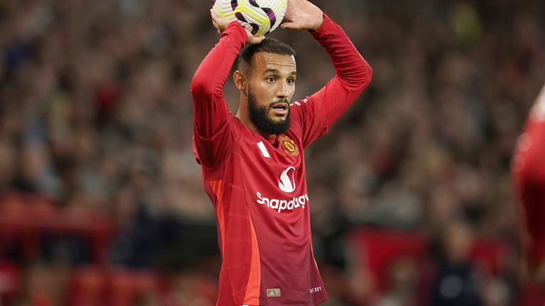 Manchester United's Noussair Mazraoui watches the Premier League football match between Manchester United and Fulham at Old Trafford on Friday, August 16, 2024 in Manchester, England. (AP Photo/Dave Thompson)