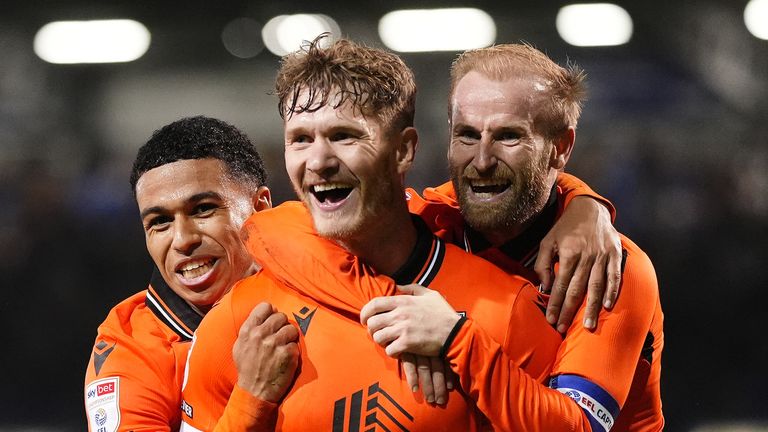 Sheffield Wednesday's Michael Smith (centre) celebrates with teammate Barry Bannan (right) and Shea Charles after scoring their side's second goal of the game during the Sky Bet Championship match at Fratton Park, Portsmouth. Picture date: Friday October 25, 2024. PA Photo. See PA story SOCCER Portsmouth. Photo credit should read: Adam Davy/PA Wire...RESTRICTIONS: EDITORIAL USE ONLY No use with unauthorised audio, video, data, fixture lists, club/league logos or "live" services. Online in-match use limited to 120 images, no video emulation. No use in betting, games or single club/league/player publications.