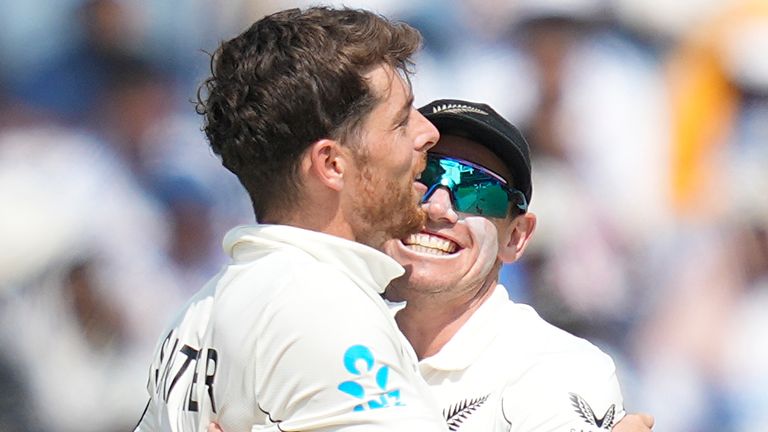 New Zealand's Mitchell Santner (left) and captain Tom Latham (right) celebrate the Test series win over India (Associated Press)