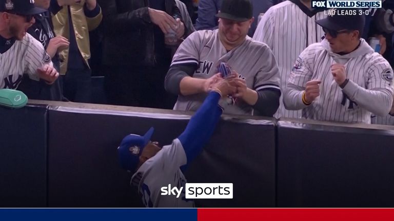 A fan at Yankee Stadium was ejected from Game 4 of the World Series after prying a foul ball out of the glove of Los Angeles Dodgers right fielder Mookie Betts on Tuesday night.

