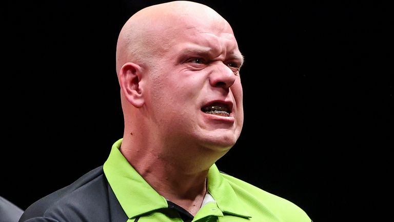 Michael van Gerwen of The Netherlands, right, celebrates after he won against his compatriot, Gian van Veen, left, in the final of the PDC European Tour Hungarian Darts Trophy in MVM Dome in Budapest, Hungary, Sunday, Sept. 22, 2024. (Robert Hegedus/MTI via AP)