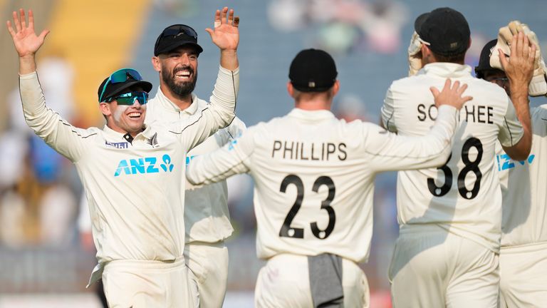 New Zealand's captain Tom Latham, left, along with his team mates celebrate after their win against India on the day three of the second cricket test match at the Maharashtra Cricket Association Stadium , in Pune, India, Saturday, Oct. 26, 2024. (AP Photo/Rafiq Maqbool)