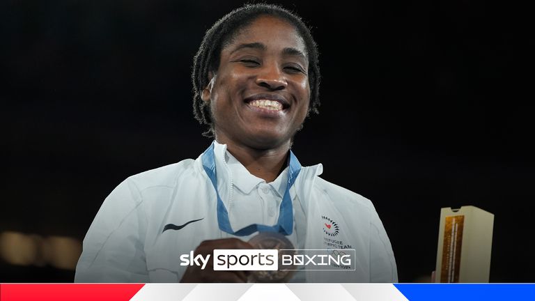 Bronze medalist Refugee Olympic Team's Cindy Ngamba poses during a medals ceremony for the women's 75 kg final boxing match at the 2024 Summer Olympics, Saturday, Aug. 10, 2024, in Paris, France. (AP Photo/John Locher)


