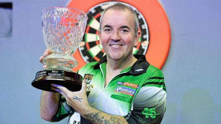 Phil Taylor holds up the trophy after winning the final against Dave Chisnall. Partypoker.com World Grand Prix Final, Citywest Hotel, Saggart, Co. Dublin. Photo credit: Barry Cregg / SPORTSFILE (Photo by Sportsfile/Corbis/Sportsfile via Getty Images)c