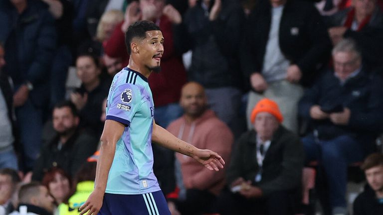 William Saliba walks off the pitch after being shown a red card