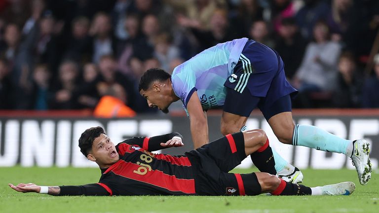 Evanilson appeals to the referee after being felled by William Saliba