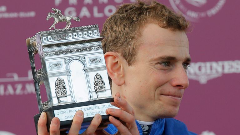 Ryan Moore lifts the Arc trophy