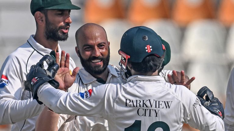 Pakistan's Sajid Khan (2L) celebrates with teammates after taking the wicket of England's Ollie Pope during the fourth day of the second Test cricket match between Pakistan and England at the Multan Cricket Stadium in Multan on October 18, 2024. (Photo by Farooq NAEEM / AFP)