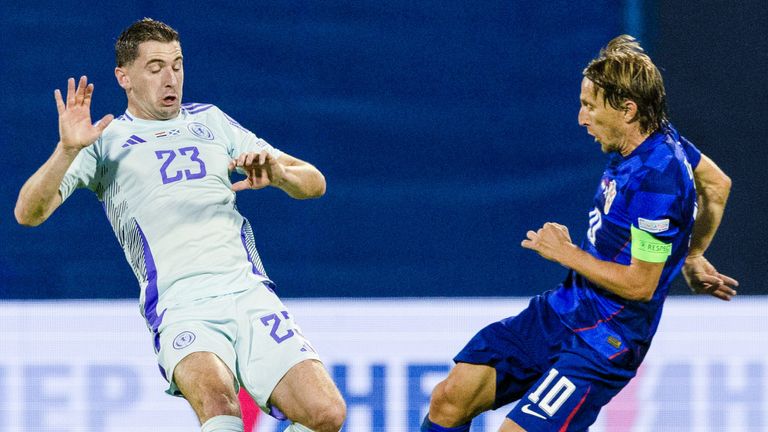 ZAGREB, CROATIA - OCTOBER 12: Scotland's Kenny McLean (L) and Croatia's Luka Modric in action during a UEFA Nations League match between Croatia and Scotland at Stadion Maksimir, on October 12, 2024, in Zagreb, Croatia. (Photo by Craig Williamson / SNS Group)