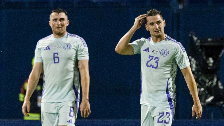 John Souttar and Kenny McLean look dejected